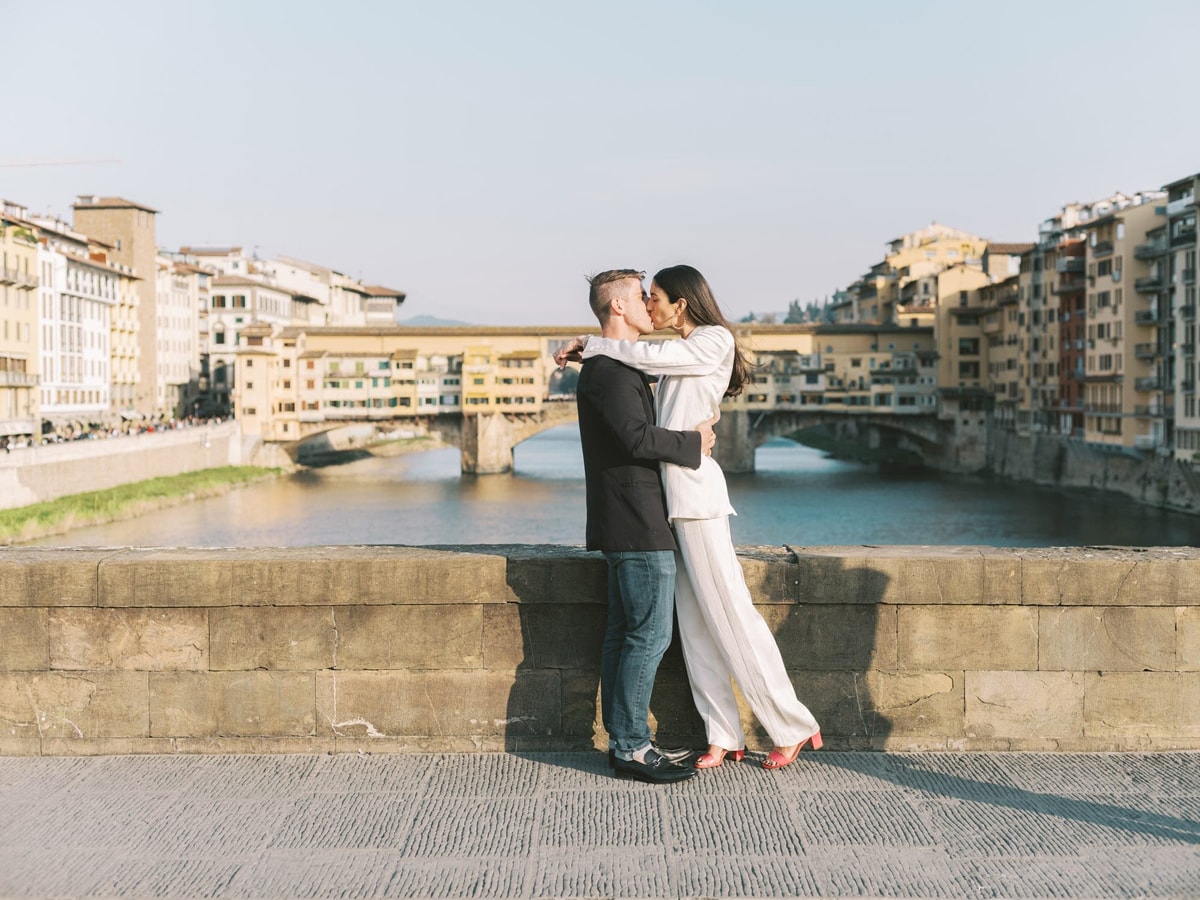 Couple embracing in fron of Ponte Vecchio during their Pre-wedding in Florence by Florence Wedding Photographer Andreas K. Georgiou